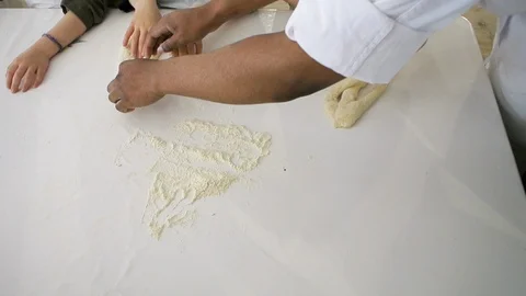 Children hands view from above preparing bread dough Video stock 111340087