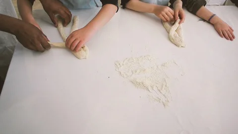 Children hands view from above preparing bread dough Video stock 111340120