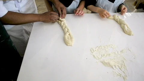 Children hands view from above preparing bread dough Video stock 111340138