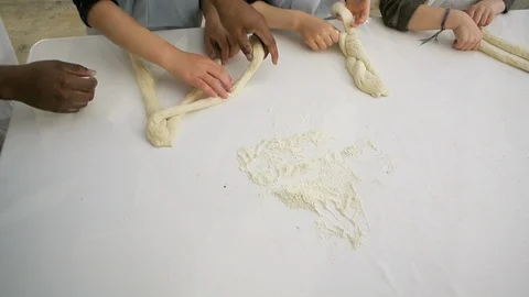 Children hands view from above preparing bread dough Video stock 111340159