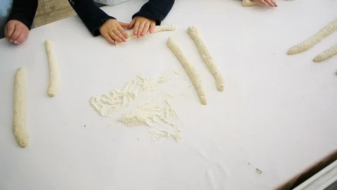 Children hands view from above preparing bread dough Video stock 111340186