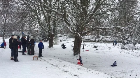 Children happily playing and exploring the beautiful Snow covered Scene Stock-Footage 84676684