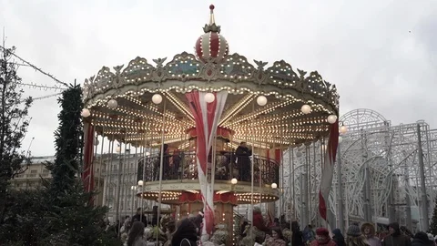 Children have fun on carousel spending time at New Year fair Stock Footage 123399156