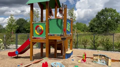 Children have fun on the playground Stock Footage 247443331