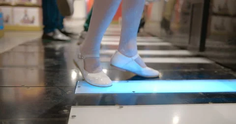 Children have fun by pushing the huge musical keyboard in the floor Stock Footage 119545430