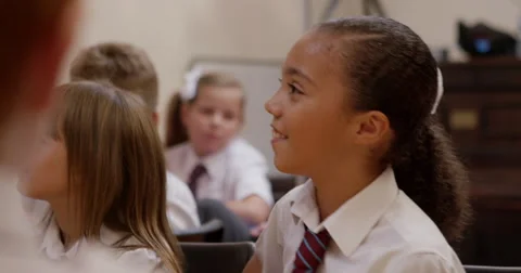 Children having a discussion in classroom Stock Footage 58573027