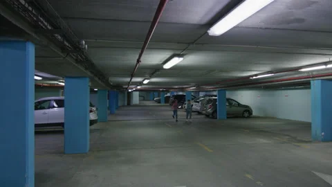 Children having fun and running in underground parking Stock Footage 236360681