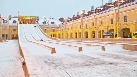 Children  having fun on the ice slide or snow slide Stock Footage 168412296