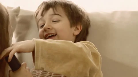Children having fun playing with vacuum cleaner. Stock Footage 22920906