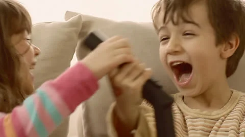 Children having fun playing with vacuum cleaner. Stock Footage 22922060