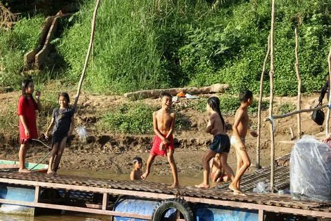 Children having fun in the river Stock Photos