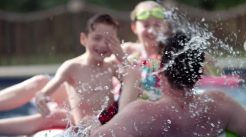 Children having fun in swimming pool. Stock Footage 64105391