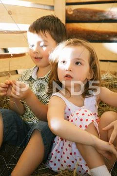 Children on hayloft Stock Photos