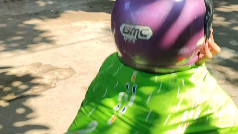 Children in Helmets Playing Traditional Sack Race Game Stock Footage 345573155