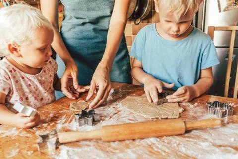 Children help mom. Stock Photos