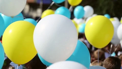 Children hold balloons Stock Footage 79841887