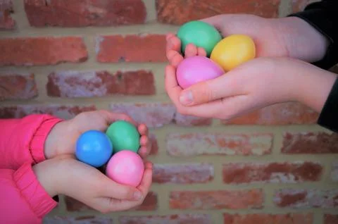 Children holding Easter eggs Stock Photos