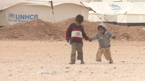 Children holding hands in Zaatari Refugee Camp Stock Footage 35789092