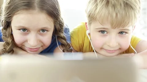  Children at home using digital tablet technology. Boy and girl in smartphone he Stock Footage 78071291