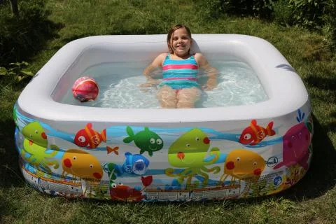 Children in the inflatable pool Stock Photos