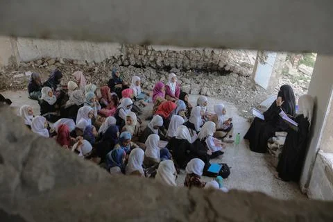 Children inside a destroyed school due to the war in Yemen, Taiz Stock Photos