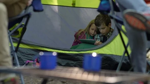 Children inside tent with digital tablet Stock Footage 88012586