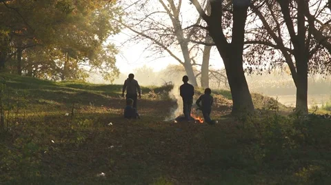 Children jump over fire Stock Footage 68535985