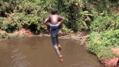 Children jump into the pond again Video stock 80476377