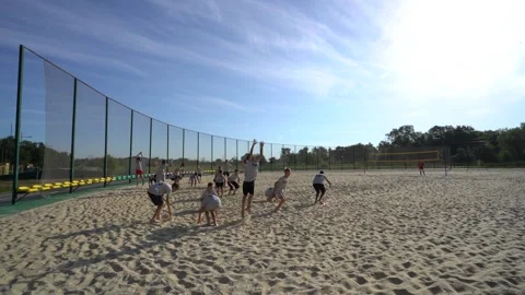 Children jump at the stadium during training in the summer Stock Footage 201603527