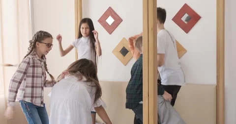 Children jumping on bed and having pillow fight Stock Footage 107294951