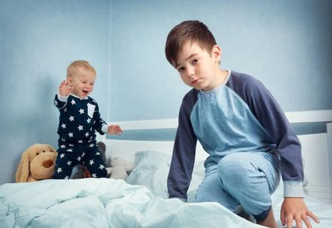 Children jumping on the bed Stock Photos