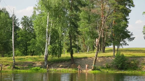 Children jumping into the lake from a height Stock Footage 51769726