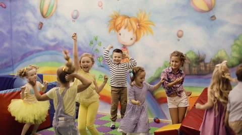 Children jumping in the playroom Stock Footage 64414076