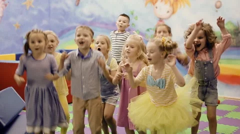 Children jumping in the playroom Stock Footage 64414174