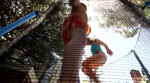 Children jumping in trampoline Stock Footage 51928750
