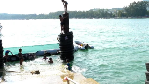 Children jumping into water Video stock 287736479