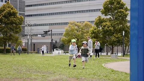 Children kindergartner playing in the park Stock Footage 75726668