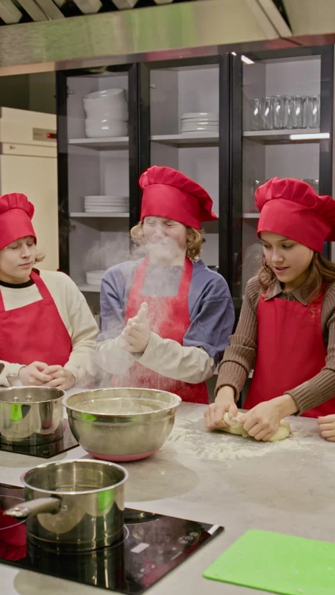 Children Kneading Dough and Clapping Hands with Flour in Cooking Class Stock Footage 339502558