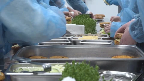 Children learn to cook a hamburger Stock Footage 310885257