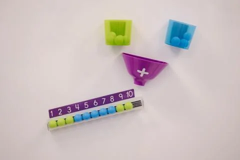 Children learn to count using colorful balls. Kindergarden. Education for kids Stock Photos