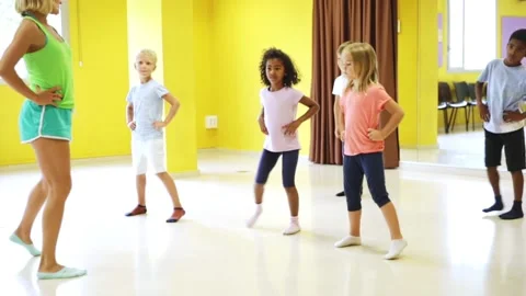 Children learn dance movements in dance class Stock Footage 133197139