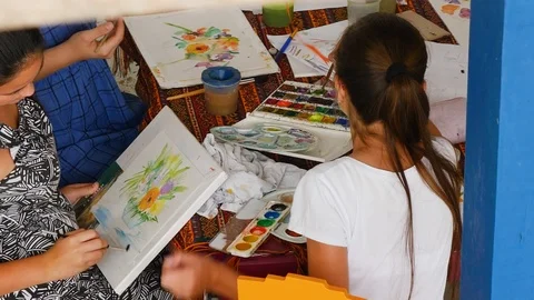 Children learn to draw. on the summer terrace draw picture girls 스톡 동영상 124864800