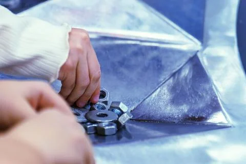 Children learn engineering by assembling metal parts Foto stock