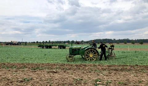 Children learn how to use an old tractor and plow during the World Ploughing Stock Photos