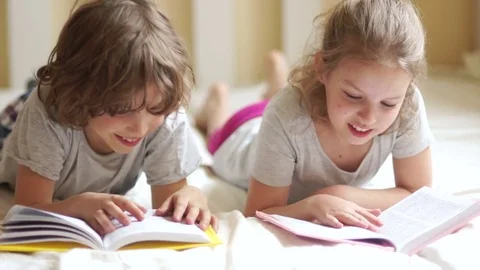 Children learn the lessons lying in bed Stock Footage 75265872