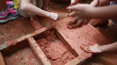 Children learn to make brick from the traditional folk wisdom. Stock Footage 82854726