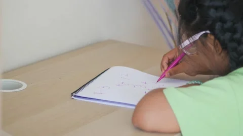 Children learn math at a study table in the afternoon Stock Footage 327516837