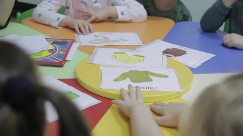 Children learn names of winter clothes in kindergarten Stock Footage 194676467