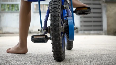 Children learn to ride a bicycle. Stock Footage 101001046