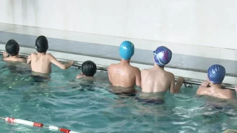 Children learn to swim in the pool. 스톡 동영상 147477482